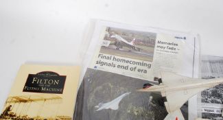A selection of items relating to Concorde to include a model Concorde, photos,