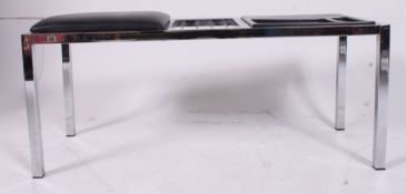 A retro chrome telephone seat,