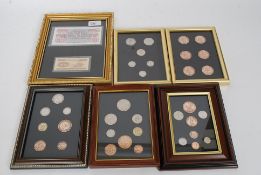 A collection of 5x framed sets of coins / banknotes, each annotated to the verso as to contents.