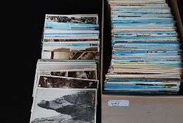 A shoebox full of postcards - mostly early to mid 20th century, to include views and others.