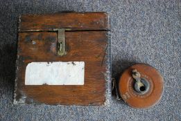 An early 20th century oak cased racing pigeon clock along with a vintage Air Ministry stamped 1939