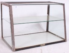 A vintage haberdashery / counter top glass display cabinet of angular form complete with the