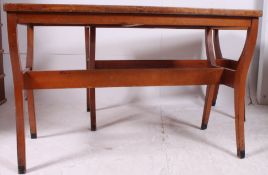 A pair of early 20th century eclesiastical pitch pine Sunday school desks having unusual shaped