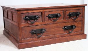 A 20th century contemporary Pandora's box coffee table having hinged top and drawers to the sides