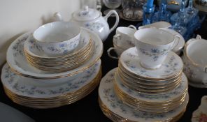 An extensive 20th century ' Duchess ' dinner service in the Tranquility pattern with blue painted