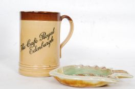 A Royal Doulton 5615 ' The Cafe Royal ' Edinburgh glazed stoneware mug together with a Royal