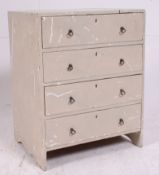 A 19th century small shabby chic painted table top chest of having a central bank of upright