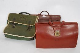 A vintage leather attache case along with a retro / vintage green fabric satchel and another