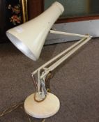 A vintage 20th century Herbert Terry anglepoise desk lamp in cream being marked to the arm for