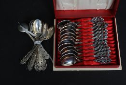 A cased set of decorative Scandinavian marked teaspoons along with another set