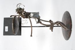 A grotesque iron work sculpture floor standing candle stick H46cm