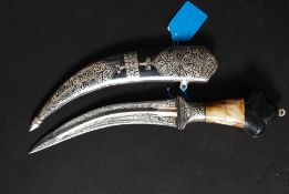 An unusual continental silver (unmarked) knife and scabbard