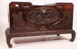 A 1950's Chinese camphorwood chest on stand.