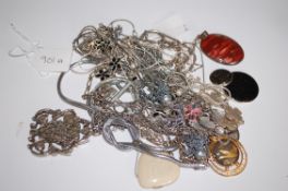 A collection of silver and white metal necklaces and pendants to include an agate stone set pendant
