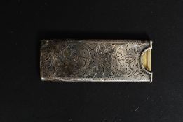A silver hallmarked stamp holder being rococo chase decorated  with central monogram cartouche.