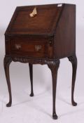 A good quality mahogany ladies writing bureau being raised on cabriole legs with pad feet.