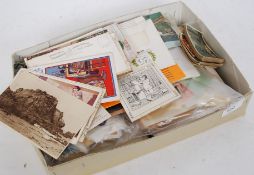 A collection of stamps / postcards etc some being loose together with album etc