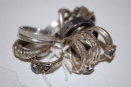 A collection 12 ladies silver and white metal dress rings to include some set with gemstones,