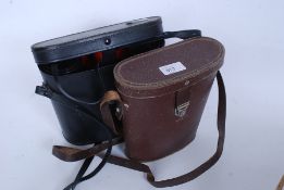 2  pairs of binoculars to include Lieberman & Gortz 12x 50 with case and a cased pair  Commodore