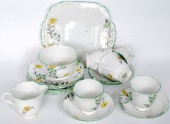 A 1930's Art Deco Melba handpainted bone china part tea service comprising cups, saucers, plates,