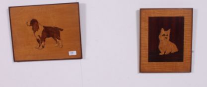 A pair of early 20th century carved in relief wooden wall plaques of dogs, one being a westie,