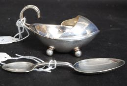 A silver plated double ended medicine spoon together with a Maple and Co silver plated medicine