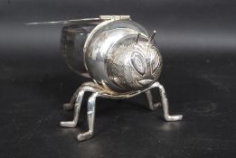 A glass and silver plated bee shaped honey pot.