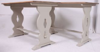 A pair of 20th century golden oak and shabby chic painted dining tables - pub tables.