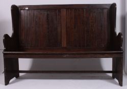 An early 20th century high back oak / pine hall settle.