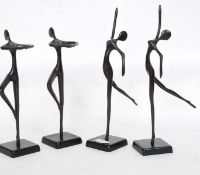 A set of four ebonised metal sculptured ballet dancer forms in various poses