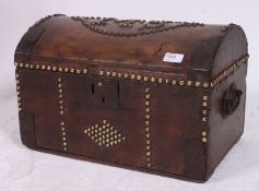A small 19th century Georgian dome top chest with brass stud worked edges and detail.