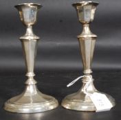A pair of Victorian silver hallmarked candlesticks by Walker & Hall bearing Sheffield hallmarks for