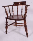 A Victorian 19th century beech and elm smokers bow / windsor armchair.