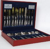 A good quality red vinyl cased canteen of cutlery by Viners.