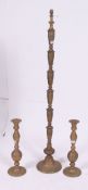 A vintage 1950's neo classical revival solid brass standard lamp together with a pair of matching