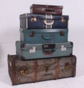 A stack of vintage trunks to include retro 50's example.