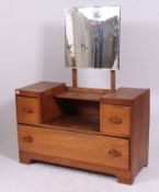 A 1930's Art Deco oak drop centre dressing table chest.