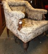 An Edwardian shabby chic mahogany salon armchair.