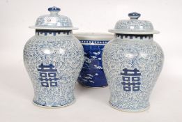 A pair of large 20th century Chinese lidded blue and white vases bearing character marks to the