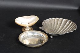 Three pieces of silver one with hallmarks and the other two pieces with continental marks pleas see