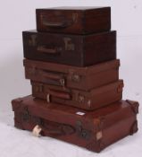 A stack of vintage trunks, mid 20th century to include leather suitcase, attache cases,