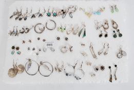 A collection of 44 pairs of silver paired earnings all mounted on board
