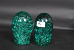 A near pair of  Victorian large green control bubble paper dumps, possibly Nailsea glass.