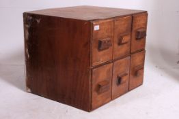 A vintage 20th century Industrial office desk top filing cabinet / stationary cupboard having
