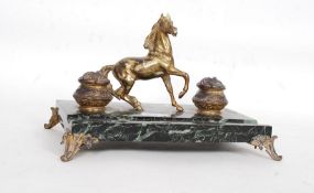 An marble base desk tidy / pen tray having a matching pair of brass ink wells and prancing horse to
