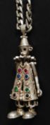 An articulated silver metal clown stamped 925 on a silver chain again stamped 925