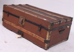 A vintage early 20th century wooden and canvas strap steamer trunk suitcase complete with the inner