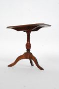 A 19th century apprentice piece mahogany tilt top dining table raised on tripod support.
