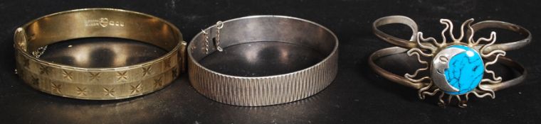 Three silver bangles, two bearing hallmarks and the other being stamped Mexico 925. 71.