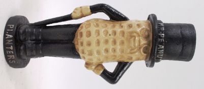 A vintage style cast iron advertising money box of Mr Peanut.